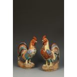 A PAIR OF JAPANESE KAKIEMON STYLE COCKERELS, each bird standing upright with its' head raised,