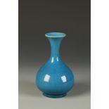 A CHINESE BLUE-GLAZED PEAR-SHAPED VASE, the finely crackled glaze in turquoise tones pooling and