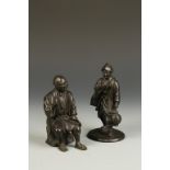 TWO JAPANESE BRONZE FIGURAL OKIMONO, one of a night watchman, the other of a seated man, Meiji, 6.