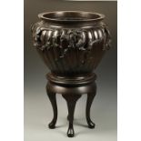 A MASSIVE JAPANESE BRONZE JARDINIERE AND STAND, the tapering rounded body of segmented form,