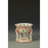 A JAPANESE KAKIEMON STYLE STAND, the rounded shoulder and swept legs decorated in green enamels