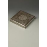 A LARGE ISFAHAN SILVER SQUARE BOX, the cover with a central relief panel of flowerheads surrounded