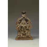 AN INDIAN BRONZE VIRABAJRA PLAQUE, the four-armed deity with a sword in one hand and standing before