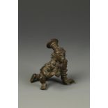 AN INDIAN BRONZE SMALL CRAWLING BALAKRISHNA, the figure with a tall hat and elaborate costume, Tamil