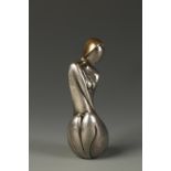 A SILVER AND GOLD NETSUKE OF A WOMAN by Georges Weil (20th century), the sensuous figure leaning