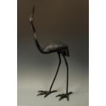 A JAPANESE LARGE BRONZE HERON by Masatoki of Kyoto, the bird stepping forward and with its' head