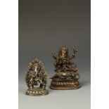 TWO SMALL HIMILAYAN GANESH FIGURES, the larger example with a deity dancing on a rodent, 18th/19th