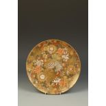 A JAPANESE SATSUMA 'MILLEFIORE' DISH decorated in enamels and gilt, some darker flowers, signed '