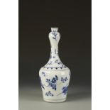 A CHINESE BLUE AND WHITE GARLIC-NECK BOTTLE VASE, the slender neck sparsely decorated with