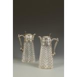 A PAIR OF VICTORIAN SILVER MOUNTED CLARET JUGS of tapering oval form, with beaded borders, the