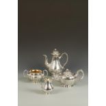 A VICTORIAN FOUR PIECE TEA/COFFEE SET of melon form, with leaf and bud finials, scroll handles,