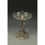 A VICTORIAN ELECTROPLATED TABLE CENTREPIECE, the central section modelled in the form of entwining