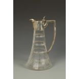A SILVER MOUNTED CLARET JUG with angular handle, faceted glass body and star-cut base, by Walker and