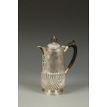 A HOT WATER POT of cylindrical form with part-fluted decoration and scroll handle, by Elkington &