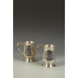 A PAIR OF GEORGE III STYLE PRESENTATION MUGS of baluster form, the scrolling handles with cast