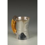 SHOOTING INTEREST: AN EDWARDIAN PRESENTATION MUG of circular waisted form, with an ivory tusk