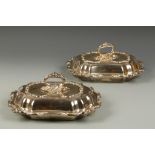 A PAIR OF ELECTROPLATED ENTREE DISHES of cushion form with detachable handles and covers, with