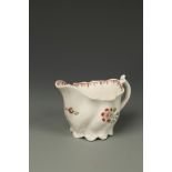 AN ENGLISH PORCELAIN LOW CHELSEA EWER CREAM JUG, with polychrome painted flower decoration on