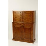 A BURR OAK COLLECTORS CABINET, the upper section with twelve short drawers above two short drawers