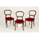 A SET OF SIX ROSEWOOD BALLOON BACK DINING CHAIRS with carved crossrails, Victorian, 34" high