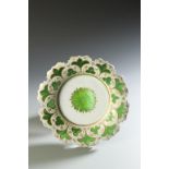 A BOHEMIAN STYLE GREEN AND WHITE OVERLAID DISH, 9.5" wide