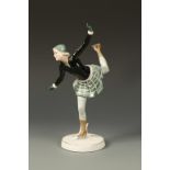 KATZHUTTE: AN EARTHENWARE FIGURE OF SONJA HENIE, A NORWEGIAN ICE SKATER, with her leg aloft,