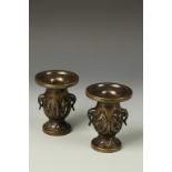 A PAIR OF ORIENTAL SILVER-INLAID BRONZE FLARED VASES, with elephant-mask handles and relief