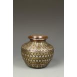 A PERSIAN MIXED-METAL JAR, with repeating foliate motifs, 19thC, 5.25" high