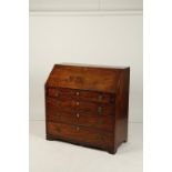 A GEORGE III MAHOGANY BUREAU with fitted interior above an arrangement of drawers, on bracket