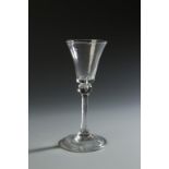 A GEORGE III WINE GLASS with flared bowl and turned over foot rim, 6.5"