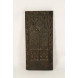 A CARVED OAK BENCH END OR PANEL carved with twin armorials, probably Victorian, 36.5" high