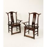 A PAIR OF CHINESE ELM ARMCHAIRS with yoke top rails, carved backs and solid seats, Qing, 45" (2).