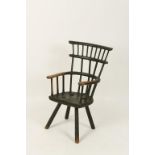 AN AMERICAN PRIMITIVE STICK BACK WINDSOR CHAIR, with 'comb' back above a shaped arms and solid seat,
