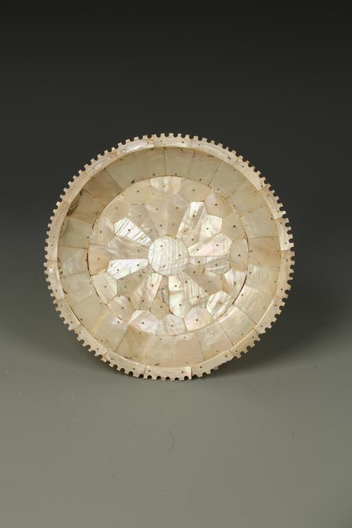 A MOTHER-OF-PEARL SHALLOW DISH, probably Goanese, of sectional construction with a notched border,