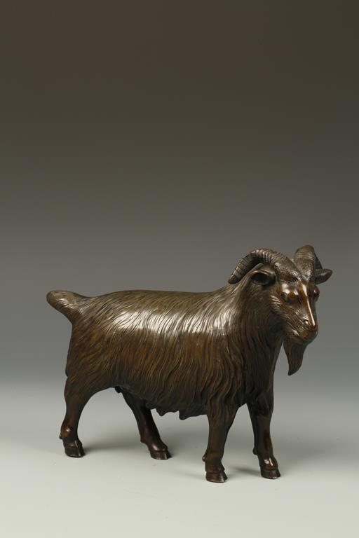 AN ORIENTAL BRONZE GOAT, with its head turned to the right, 19thC, 10.5" long