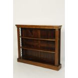 A REGENCY ROSEWOOD AND BRASS MOUNTED OPEN FRONTED BOOKCASE, 48" wide  Provenance: With a label to