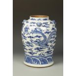 A LARGE CHINESE BLUE AND WHITE JAR decorated with dragons, Qing, 19thC, 13.75" high