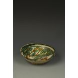 A NISHAPUR STYLE GREEN-GLAZED BOWL, with incised decoration, 7" dia.