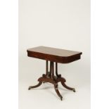 A REGENCY MAHOGANY AND EBONY STRUNG FOLD-TOP CARD TABLE on a platform base and splayed legs, 36"