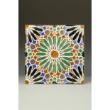 AN HISPANO-MORESQUE STYLE POLYCHROME TILE, with geometric relief decoration, 10.75" square