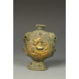 A TIBETAN COPPER FLASK, with mask decoration, 18th/19thC, 5.5" high