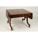 A REGENCY MAHOGANY AND BRASS INLAID SOFA TABLE on narrow outswept legs, 37" wide