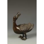 A CHINESE BRONZE DUCK CENSER, the head turned backwards, Qing, 18th/19thC, 6" long