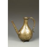 A MUGHAL BRASS PEAR-SHAPED EWER, engraved with repeating floral motifs, 18th/19thC, 8.25" high