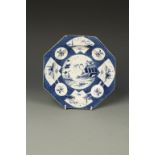 A WORCESTER OCTAGONAL PLATE, painted in blue, in Chinese style, with landscapes and flowers, on a