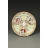 A COALPORT PORCELAIN PLATE, polychrome painted with a chaffinch on a branch and flowers on a pale