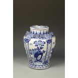 A CHINESE BLUE AND WHITE COVERED JAR decorated with panels of flowers, Qing, 19thC, 13" high
