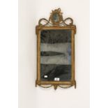A WALL MIRROR with rectangular plate between an oval portrait of Liberty seated beneath stars within