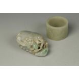 A CHINESE JADEITE CARVING of a chilong on a gourd, 3.25" long; and a jade ring carved with horses,