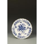 A WORCESTER BLUE AND WHITE PORCELAIN CHARGER, 'Pinecone' pattern, crescent mark on underside, 18th